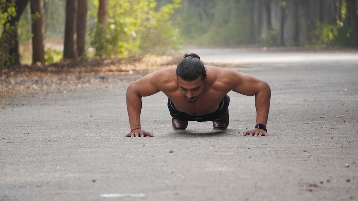 a person squatting on the ground